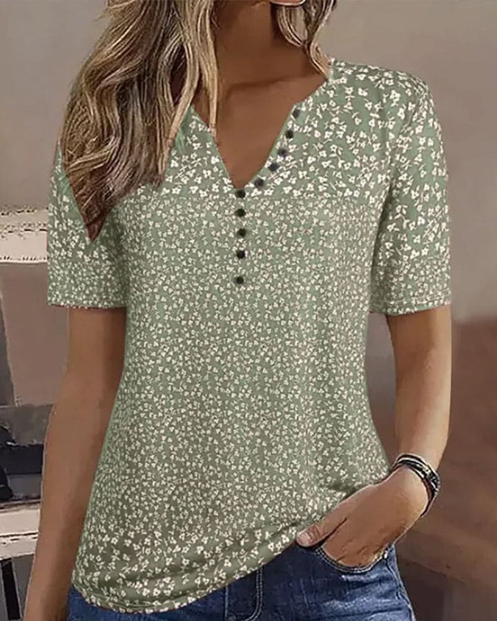 Relaxed fit women's floral summer top with short sleeves, perfect for casual elegance & comfort.