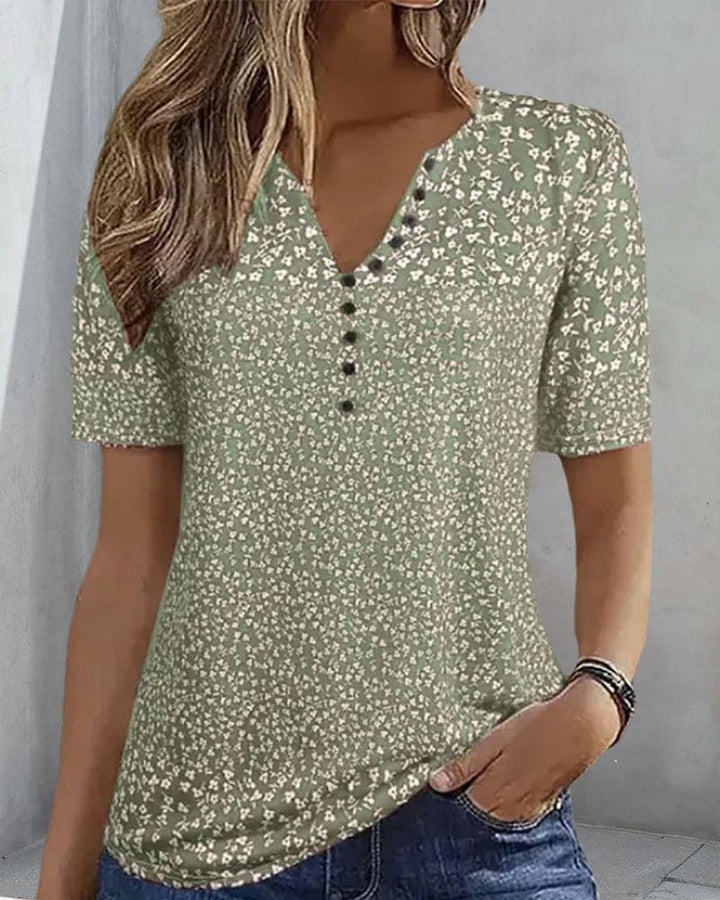 Chic women's green floral short sleeve shirt, an elegant blouse for stylish summer apparel.