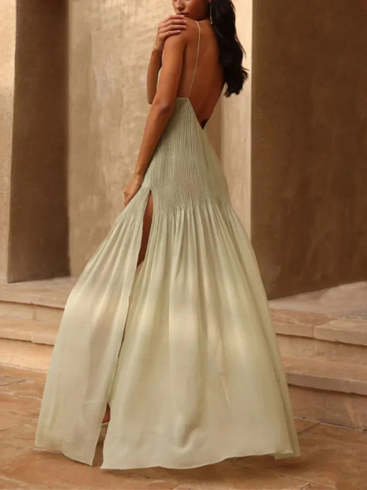 Sophisticated flowy green pleated maxi dress for women, ideal as a wedding guest, bridesmaid, or special occasion gown.