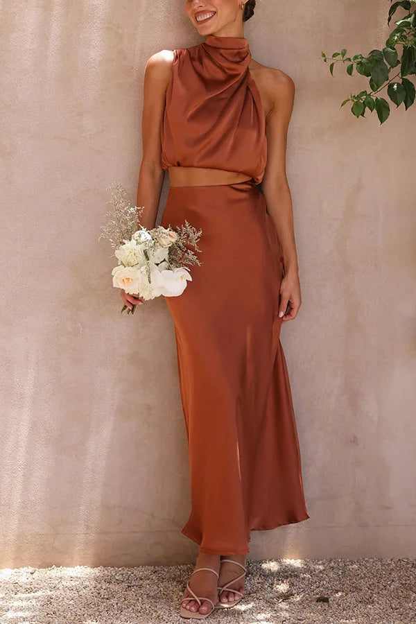 Elegant women's halter crop top and flowing maxi skirt 2-piece set for special occasions.