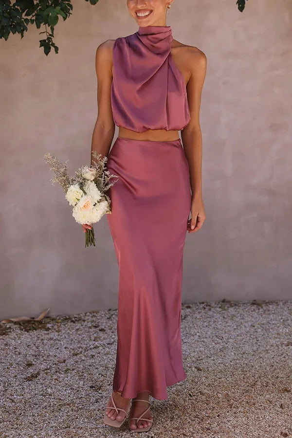 Chic halter crop top & draped maxi skirt set, perfect for evening wear or wedding guests.
