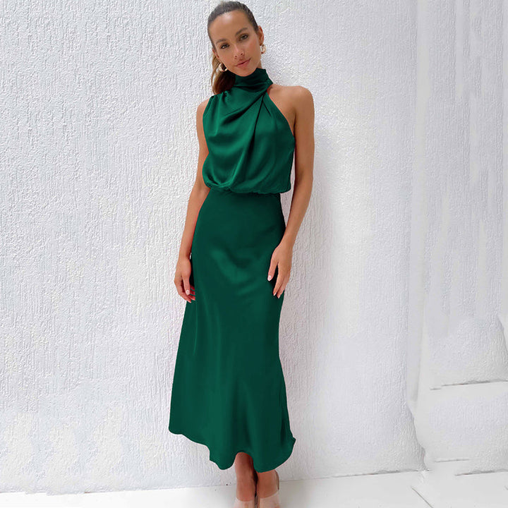 Gorgeous women's party gown, halter neckline, dramatic open back, long and flowing skirt.