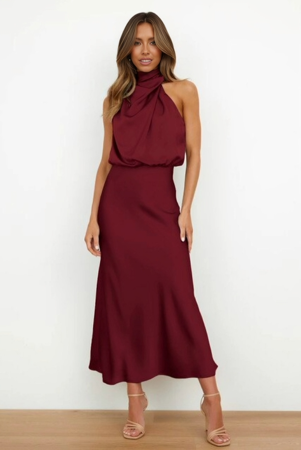 Sophisticated women's formal halter dress, open back, floor-length silhouette, evening wear.