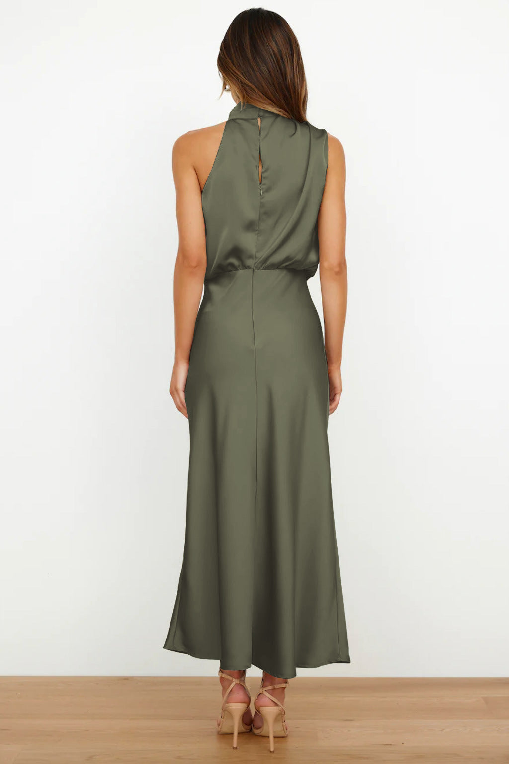 Women's elegant halter evening gown in a dynamic pose, ideal for a prom or party dress.