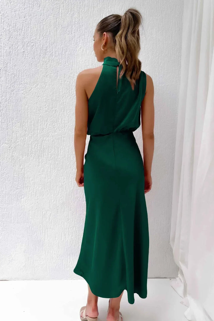 Glamorous women's party dress: a floor-length halter evening gown with an open back.