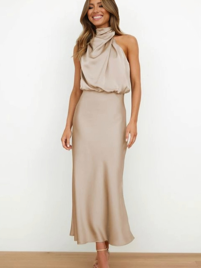 Flowing fabric of a women's elegant halter gown, perfect as a prom or party dress.