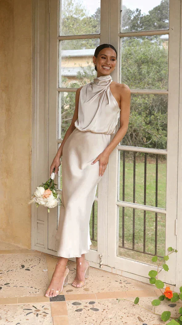 Elegant women's halter midi dress, flowing for special events and occasion wear.