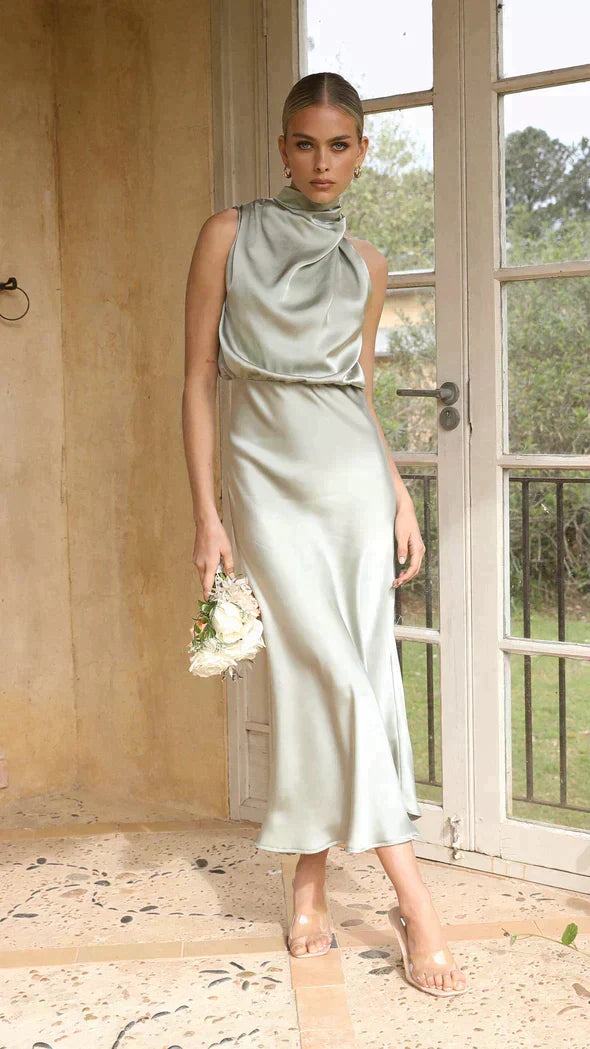 Women's elegant party dress: flowing halter midi style for versatile fashion.