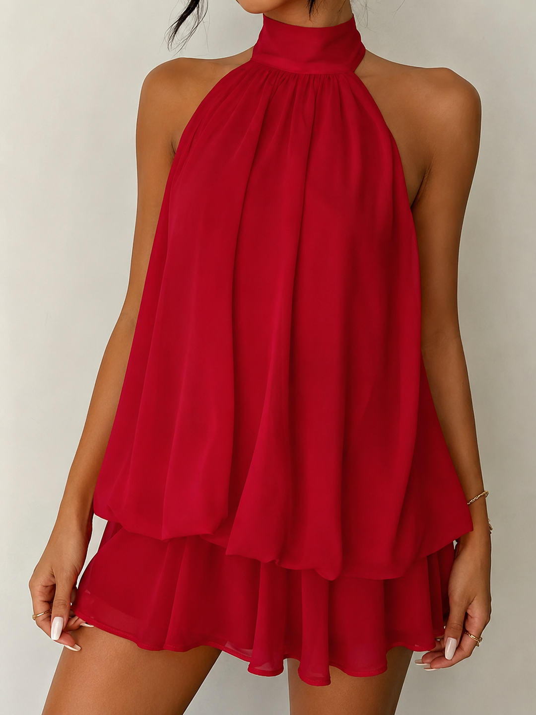 Trendy women's mini party dress, halter design, open back, and a graceful ruffle hem.