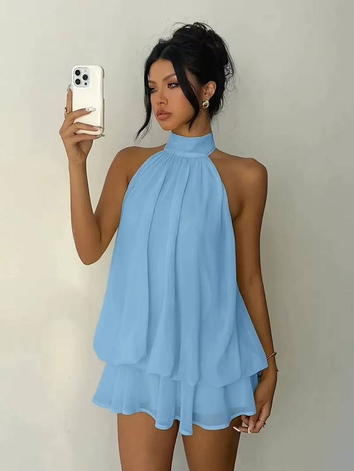 Graceful women's elegant mini dress with a halter neck, ruffle hem, suitable for evening.