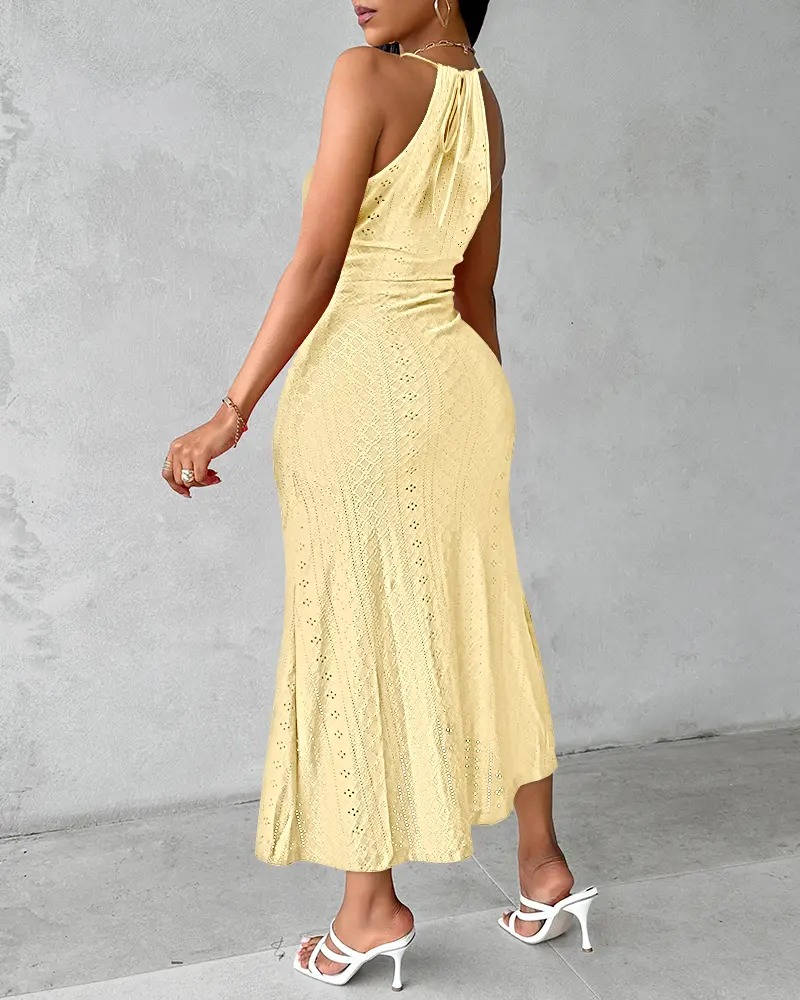 Detail shot of the high slit on an elegant women's halter neck A-line maxi gown, perfect for evening wear.