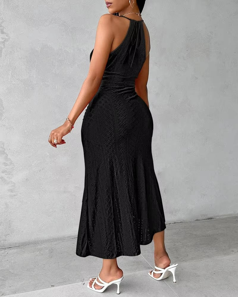 Full-length view of an elegant women's halter neck maxi dress with a high slit & flowing A-line skirt.