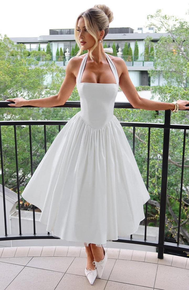 Elegant women's halter neck midi cocktail dress, perfect for sophisticated special occasions.