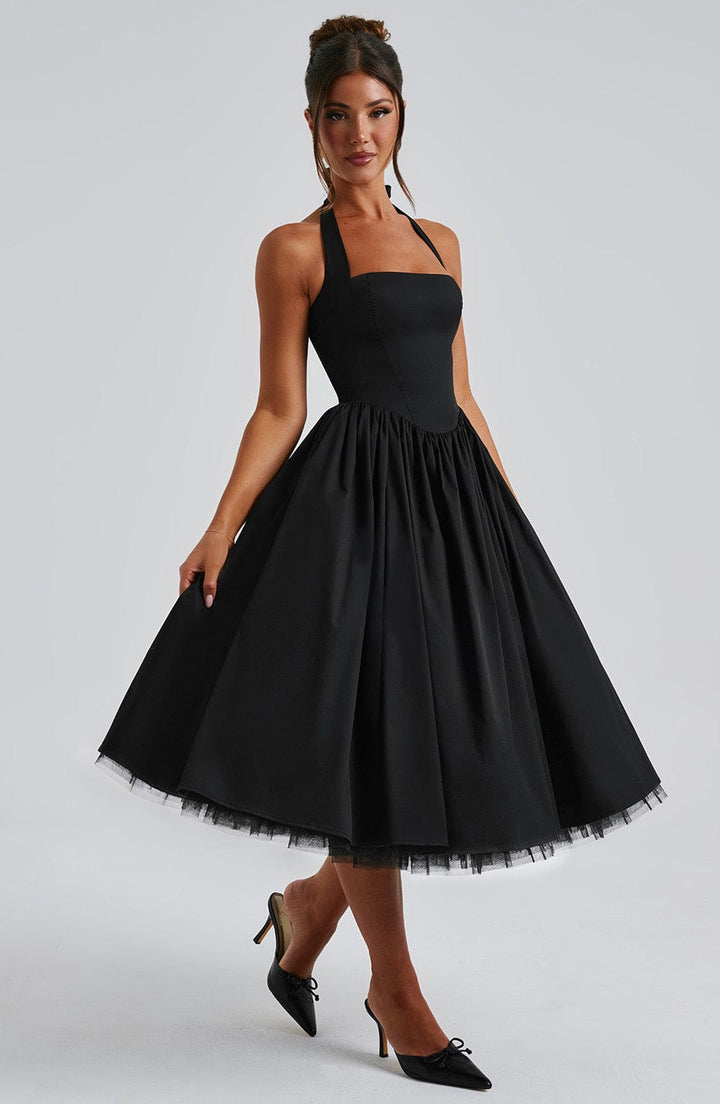 Women's elegant halter neck midi dress, a versatile piece for cocktail parties & sophisticated gatherings.