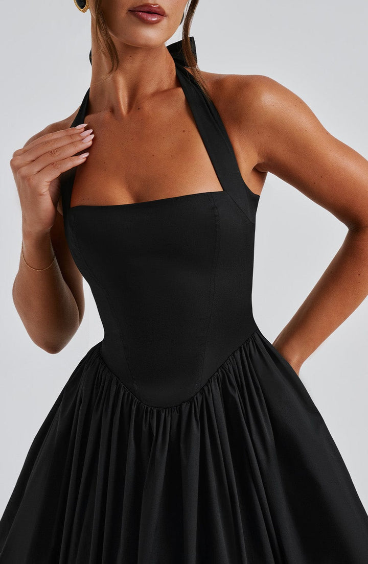 Sophisticated women's formal halter neck midi dress. Perfect for elegant cocktail parties.