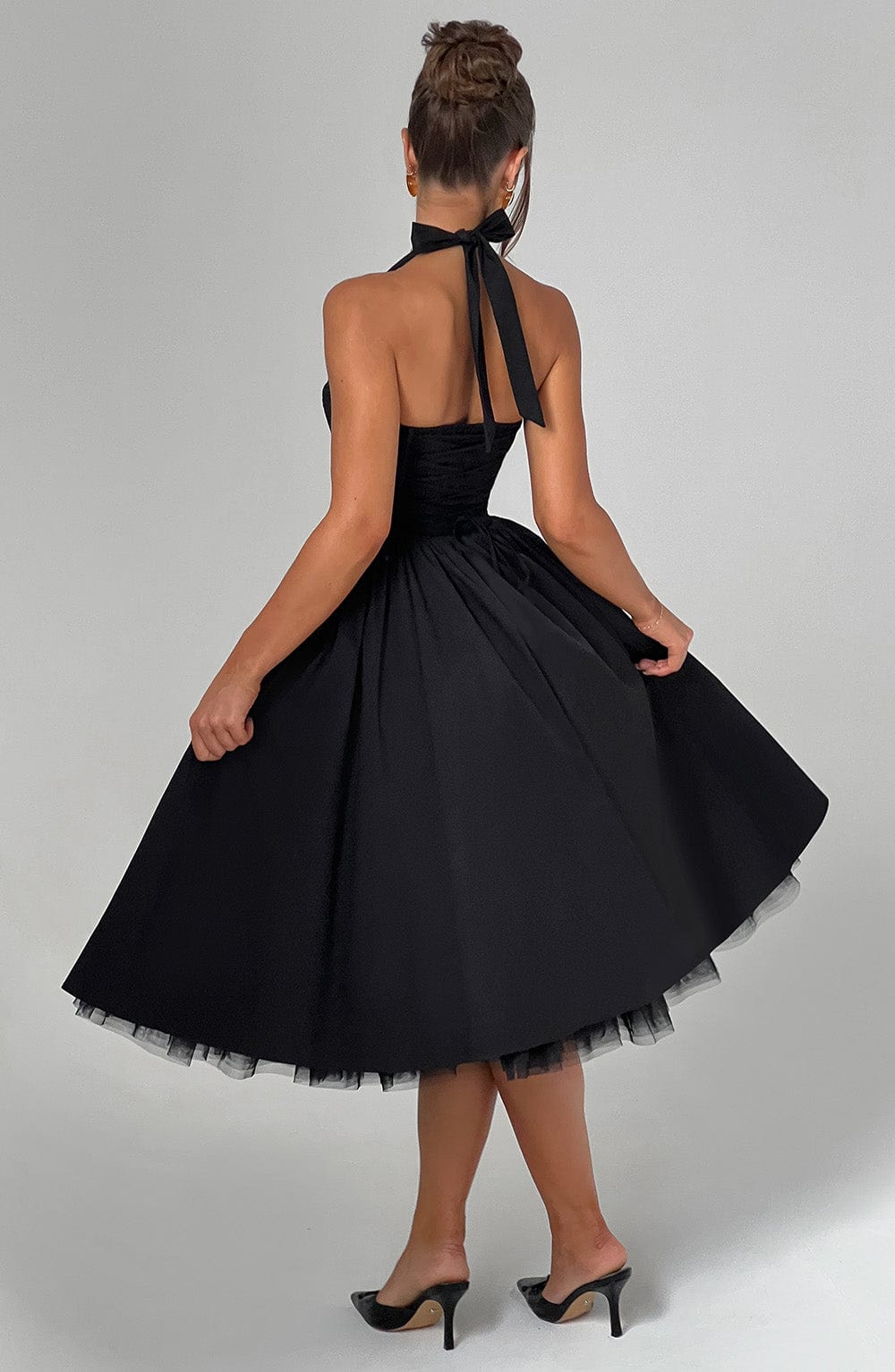 Women's timeless halter neck midi dress, an elegant and feminine choice for any formal occasion.