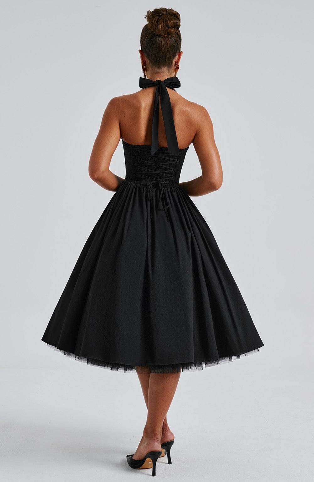 Chic women's party midi dress featuring a flattering halter neck and elegant fit and flare style.