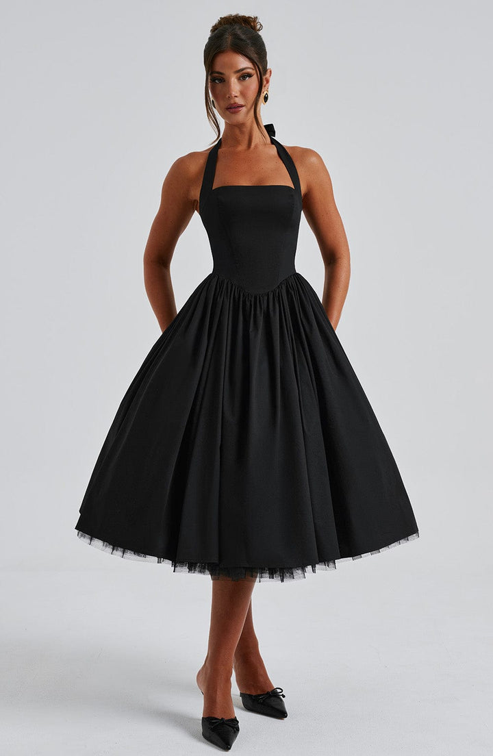 Elegant women's halter neck midi dress, perfect for special occasions. Features a graceful silhouette.