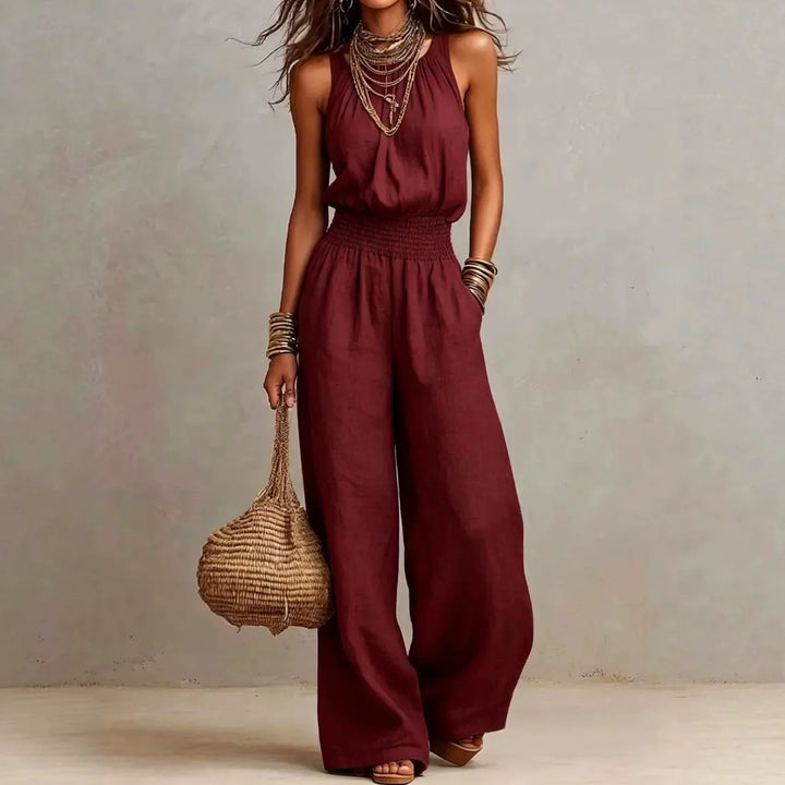 Versatile women's one-piece halter neck wide leg jumpsuit, great for vacation, resort, or elegant casual wear.