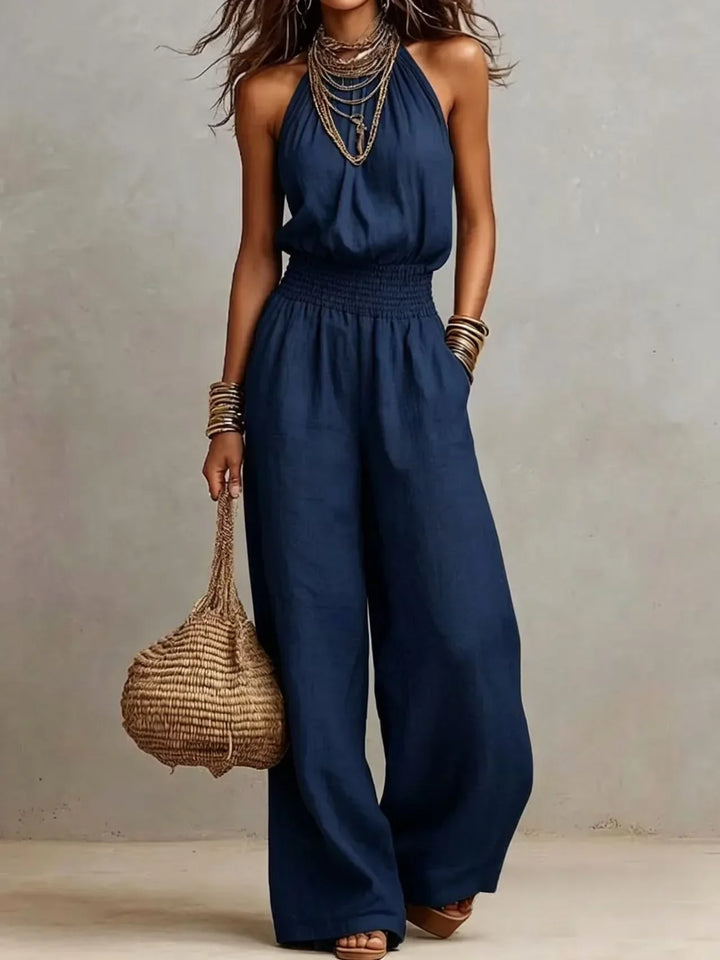 Chic women's halter neck wide leg jumpsuit, a sleeveless summer outfit with a comfortable, flowy design.