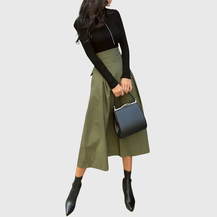 Elegant women's high-waist A-line green midi skirt with delicate pleats, perfect for office or spring casual wear.