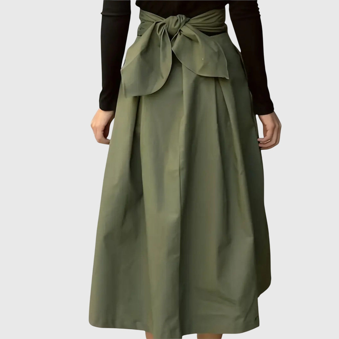 Women's elegant green A-line midi skirt with a high waist and pleated design, versatile for casual, office, or chic styles.