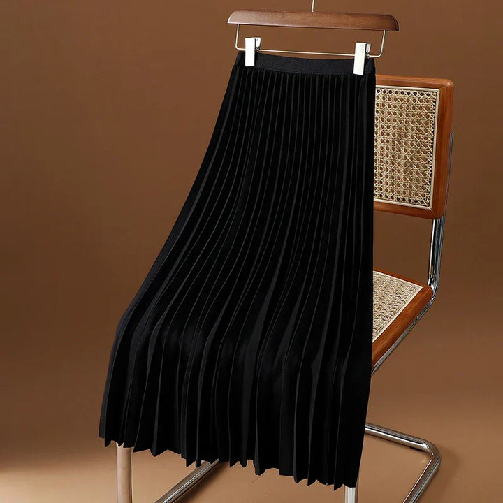 Timeless women's high-waisted pleated midi skirt, a chic and essential piece for feminine apparel.
