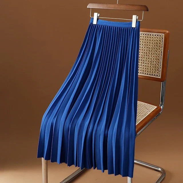 Feminine pleated midi skirt for women with an elegant high waist, ideal for day-to-night styling.