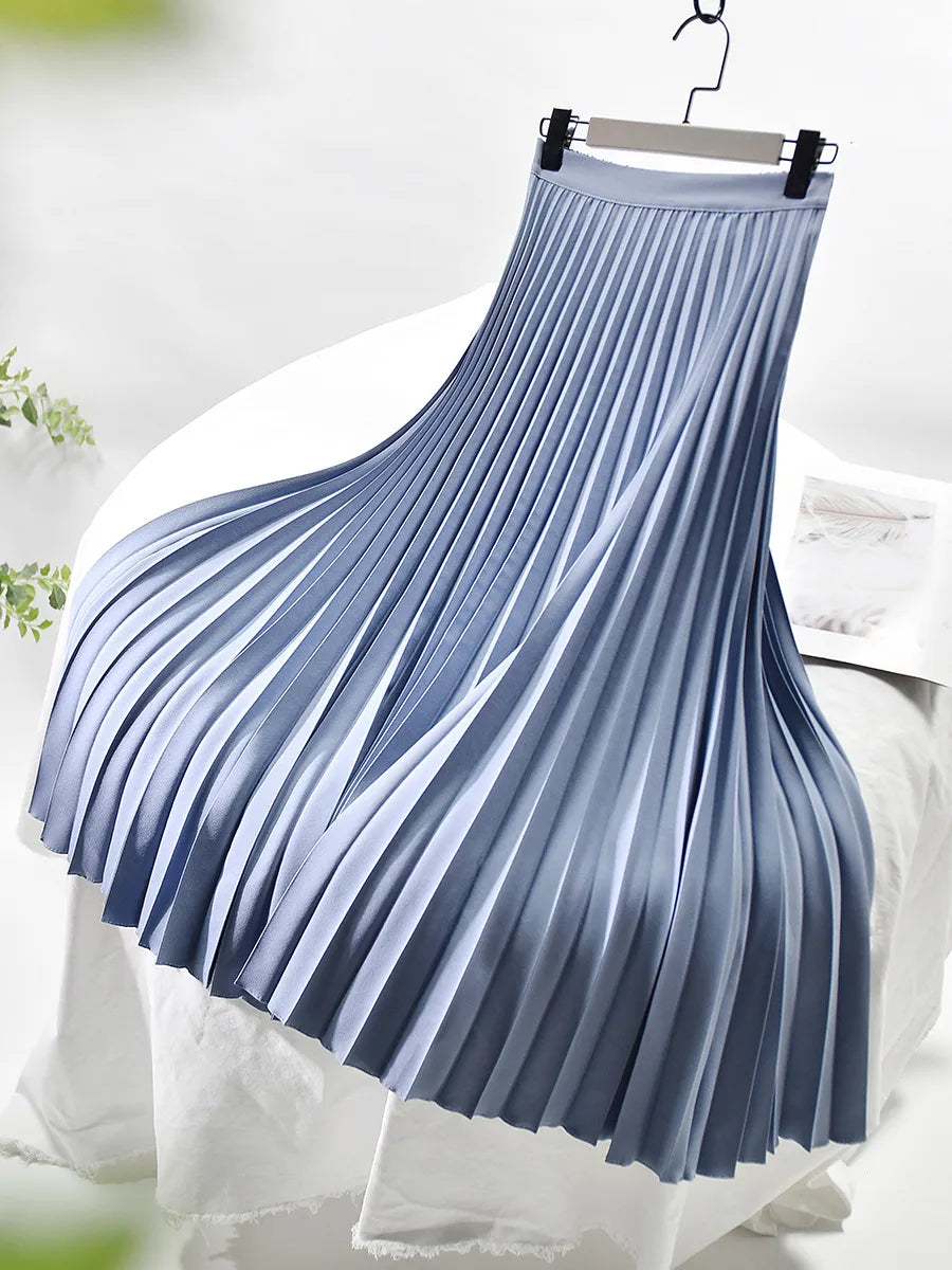 Fashionable women's midi skirt with graceful pleats and an elegant high-waist silhouette.