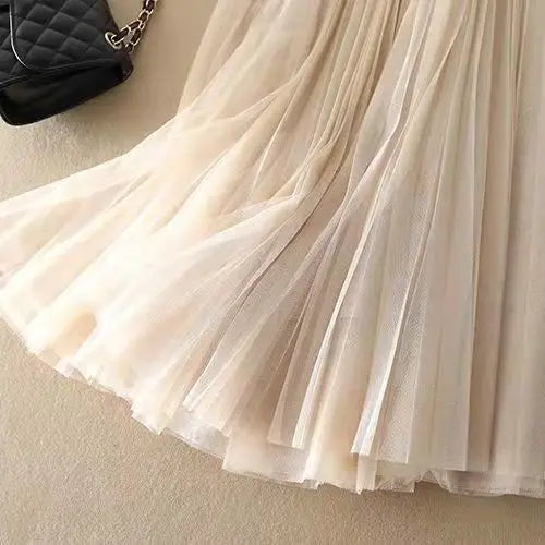 Modern high-waisted pleated midi skirt, a must-have for womens fashion, combining style and elegance.