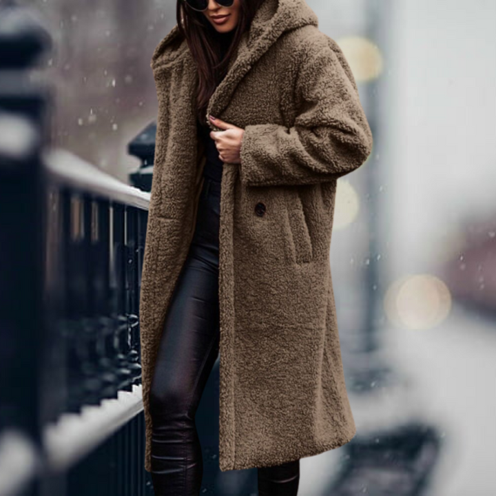 Comfortable women's hooded winter jacket, ideal for elegant warmth and stylish cold weather comfort.