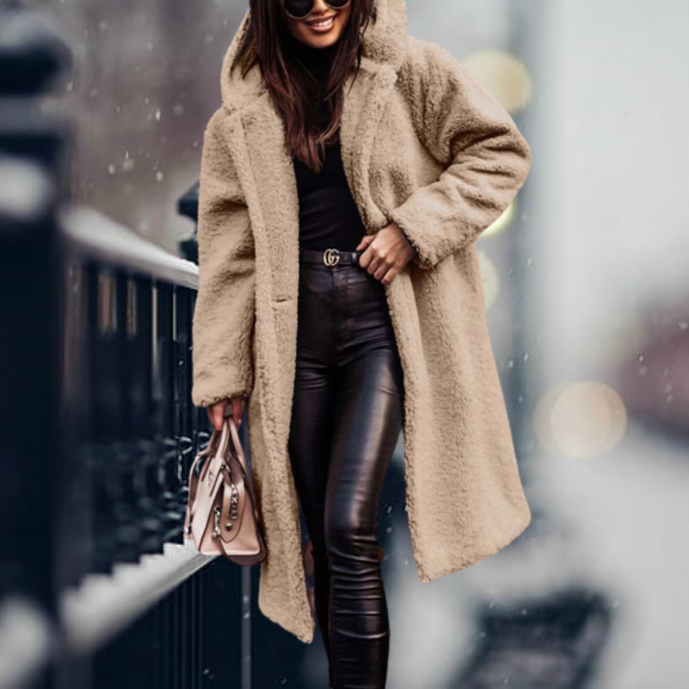Soft, warm women's hooded winter jacket, providing cozy comfort and elegant style for cold weather.
