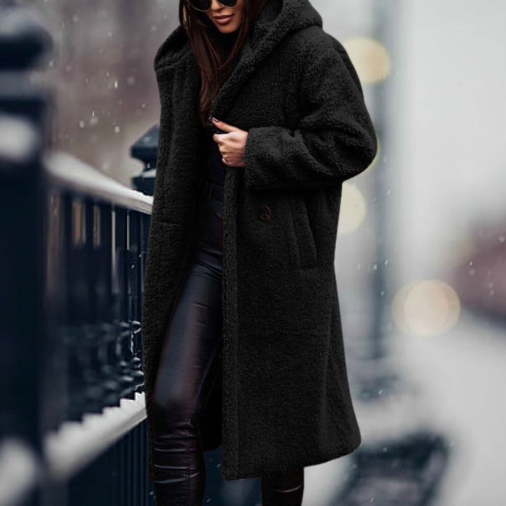 Warm women's hooded winter coat, providing cozy protection & elegant style for cold weather outerwear.