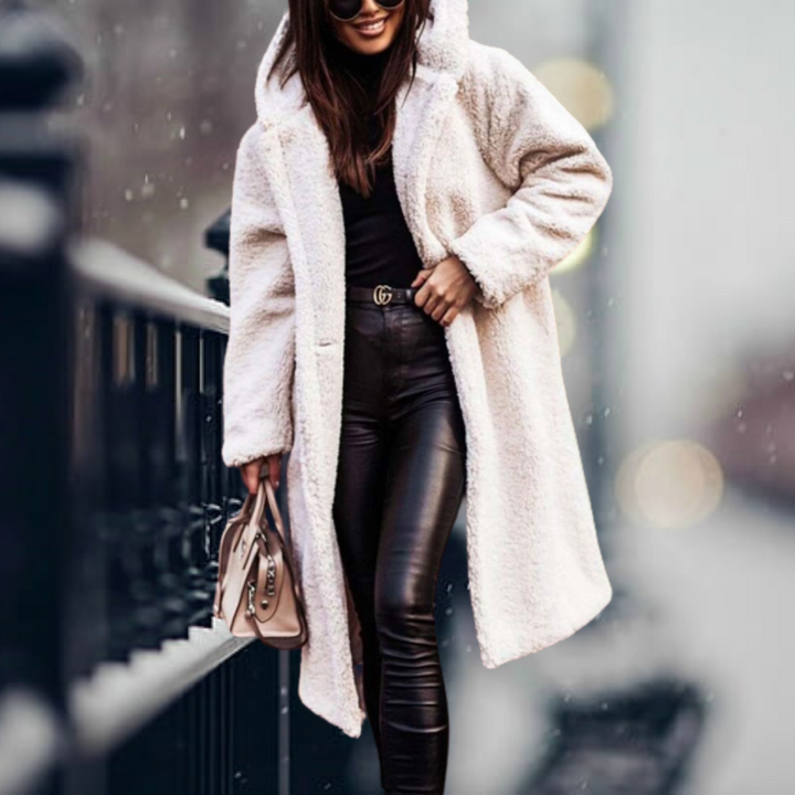 Long sleeve women's winter jacket with hood, providing elegant warmth and cozy comfort for cold weather.