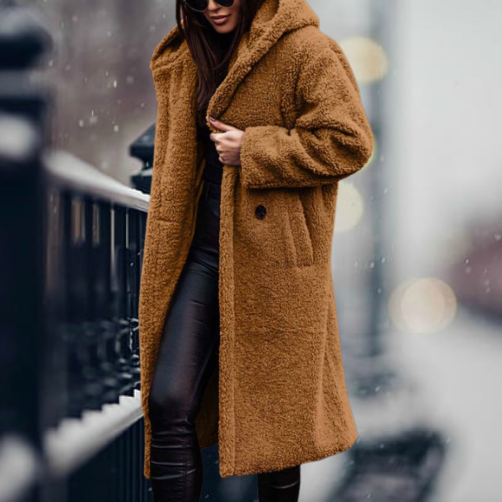 Stylish elegant women's hooded winter coat, designed for cozy warmth and fashionable cold weather wear.