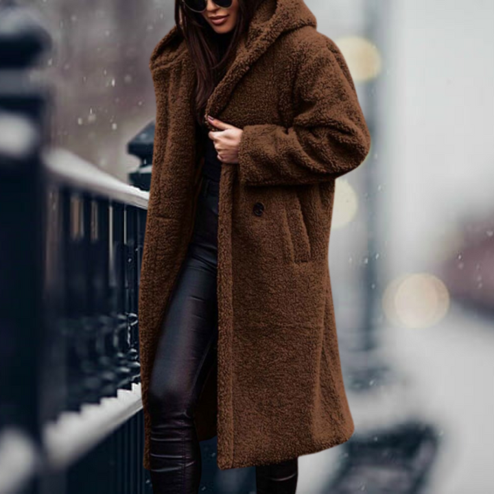 Premium women's hooded winter jacket, offering elegant warmth and essential cold weather protection.