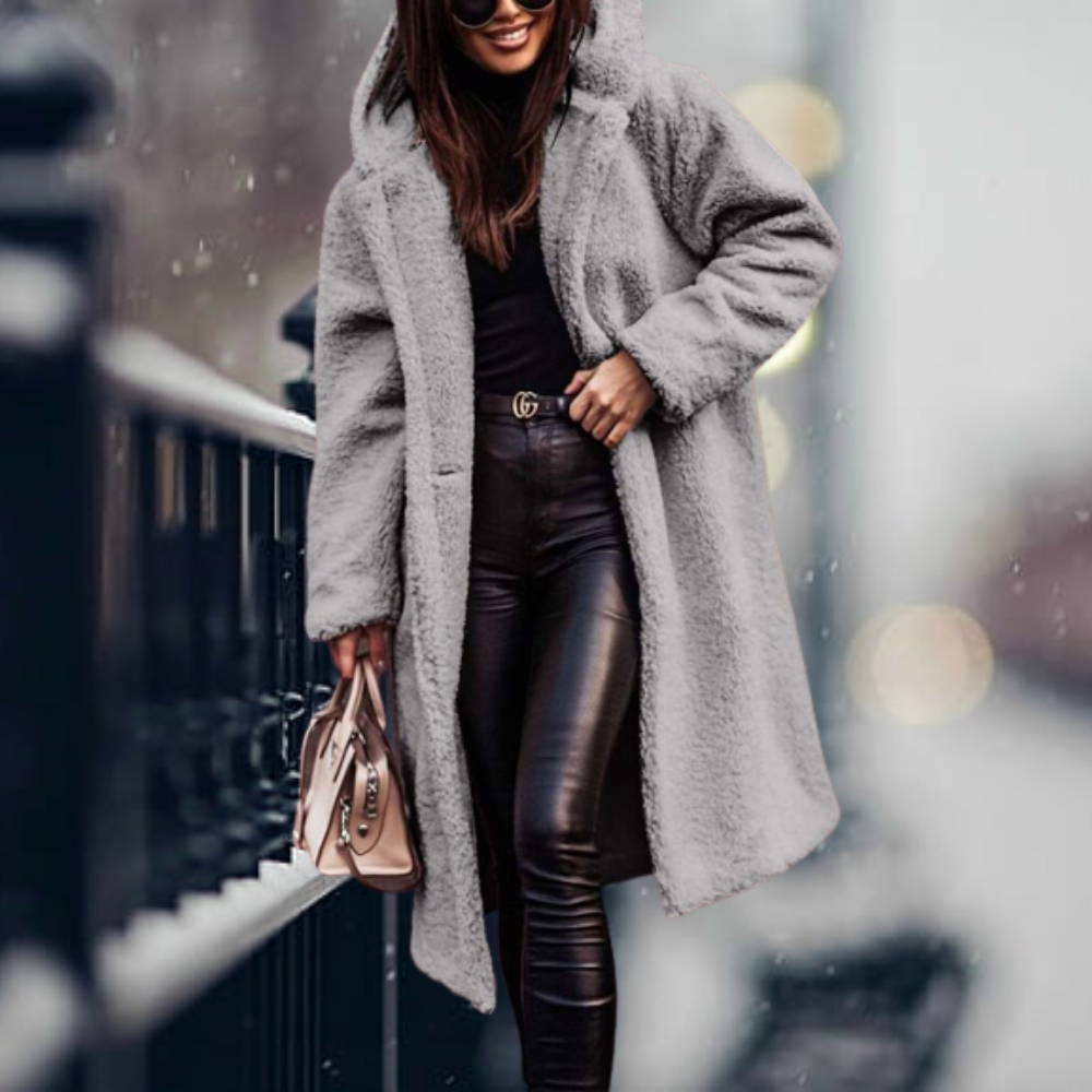 Super cozy women's hooded winter coat, perfect for elegant warmth and seasonal style in cold weather.