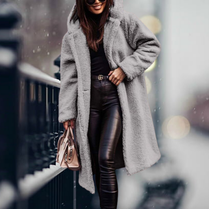 Super cozy women's hooded winter coat, perfect for elegant warmth and seasonal style in cold weather.