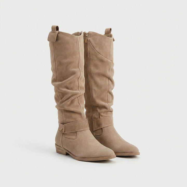 Stylish women's knee-high boots, comfortable fit with low heel, perfect for elegant fall & winter fashion.