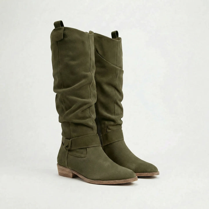 Women's elegant knee-high boots with subtle bow accent, comfortable low heel, and practical side zipper.