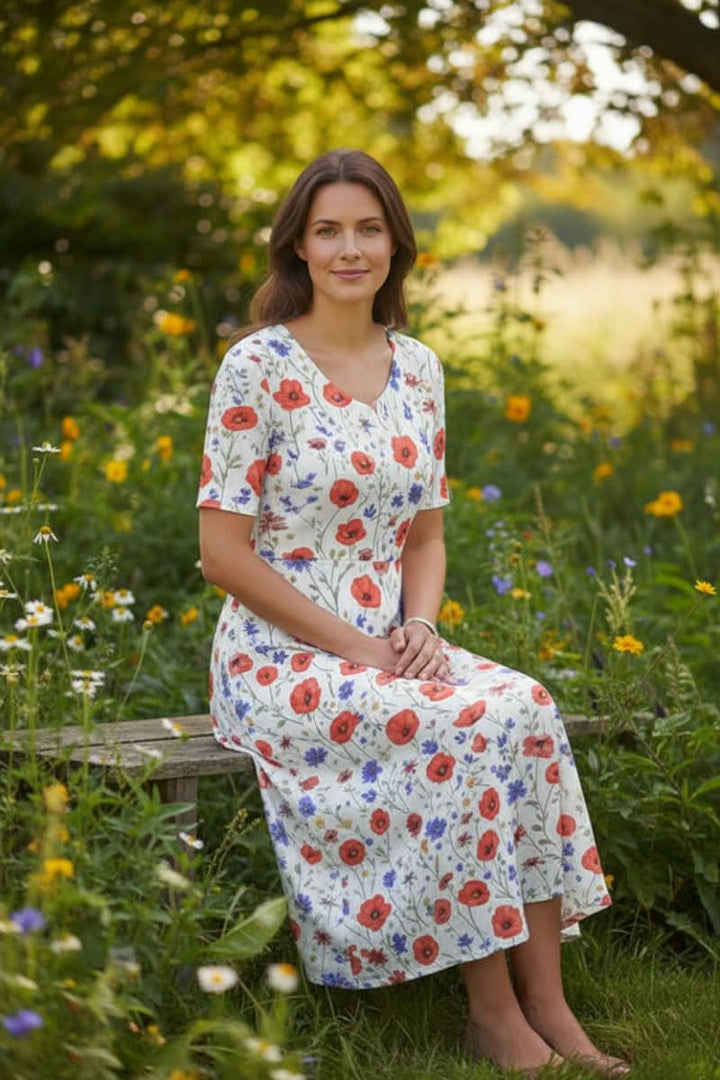 Elegant women's knee-length floral dress with pockets, perfect for summer casual or semi-formal occasions.