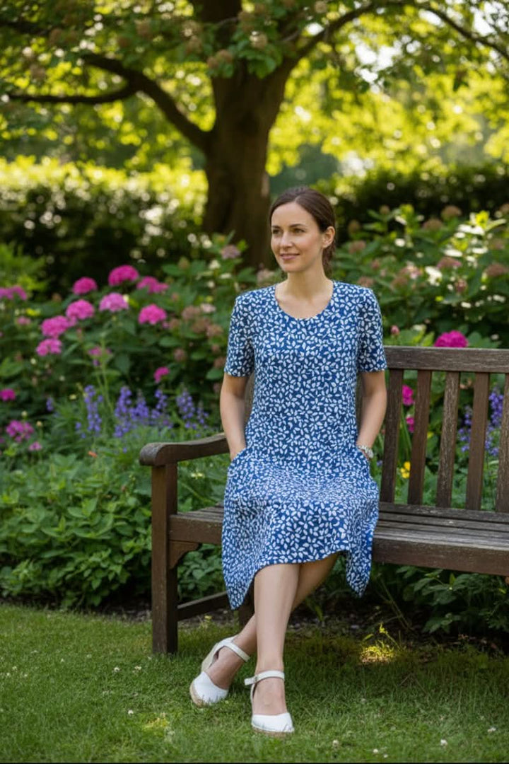 Comfortable slip-on women's floral knee-length dress with pockets, great for easy summer styling.