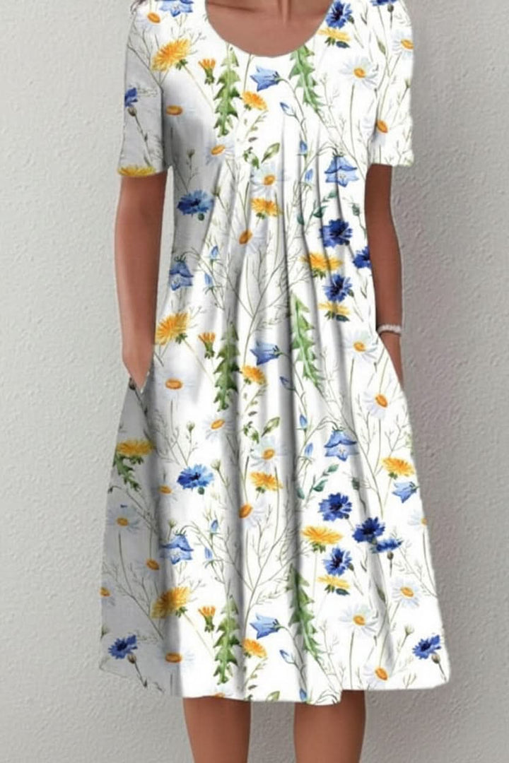 Elegant yet casual women's floral knee-length summer dress with convenient pockets for everyday style.