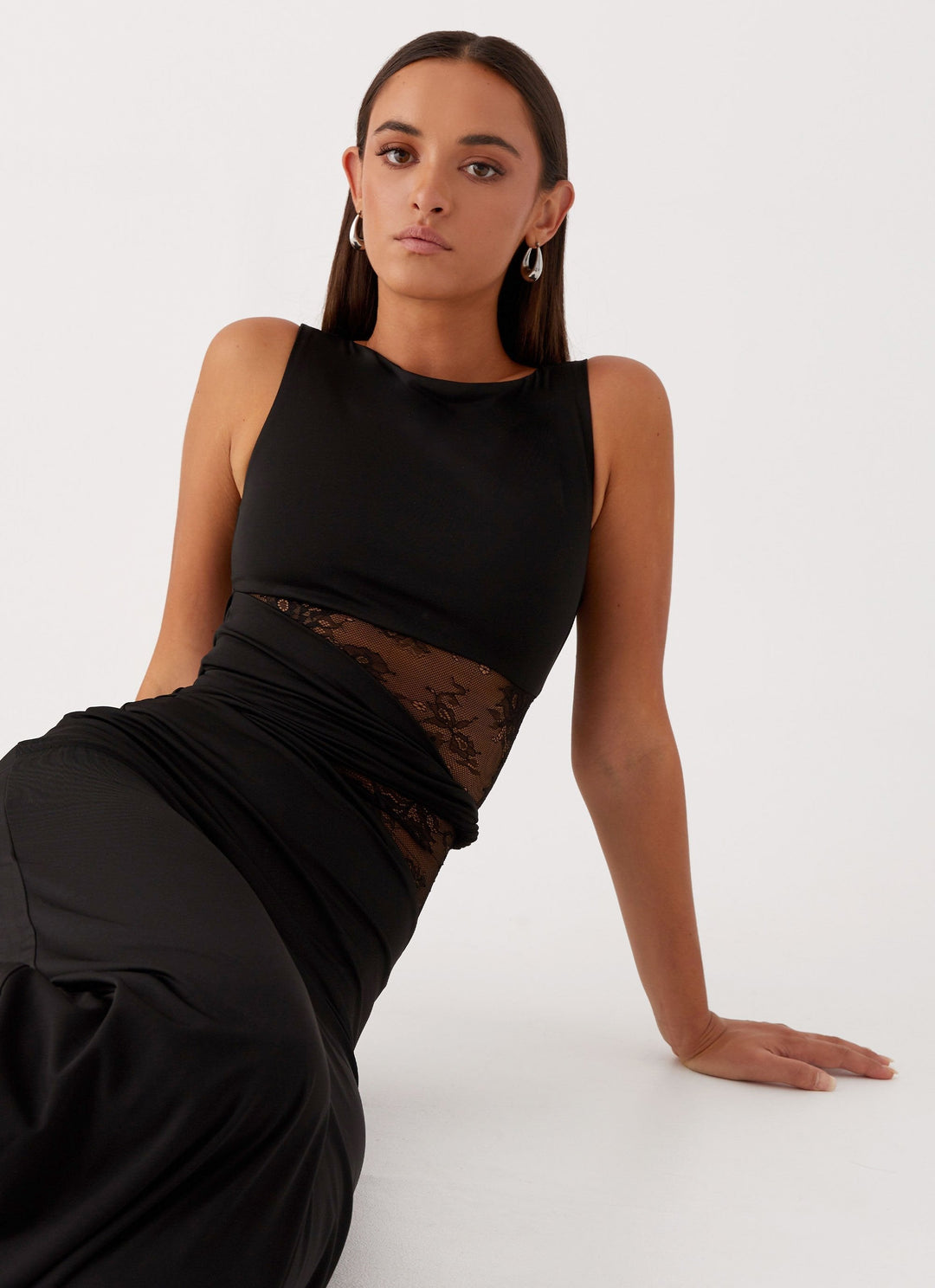 Sophisticated women's sleeveless maxi dress with a boat neck and delicate lace cut-out detailing, a formal evening gown.