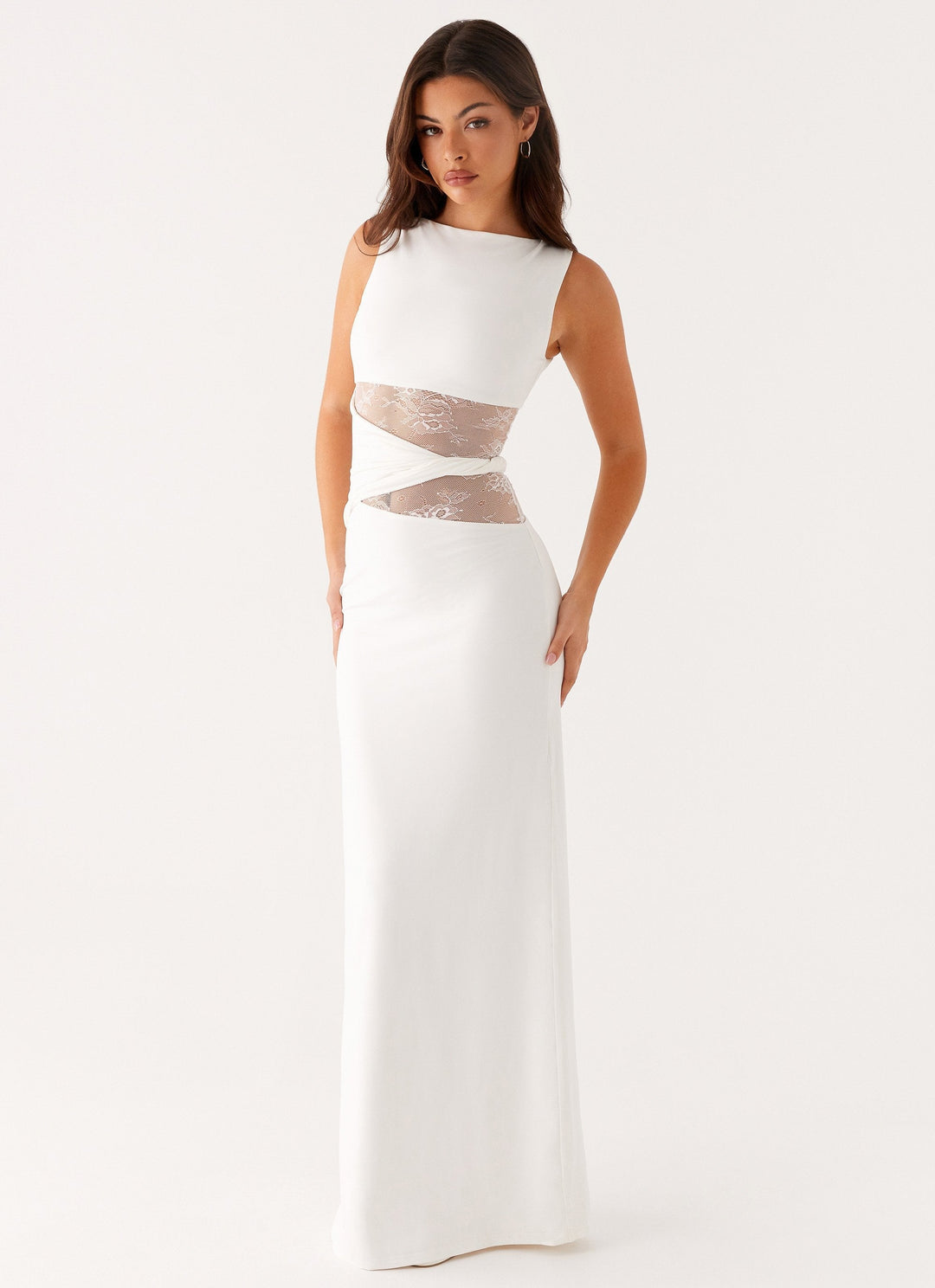 Fashionable women's long party dress, featuring a boat neck, sleeveless design, and intricate lace cut-outs.