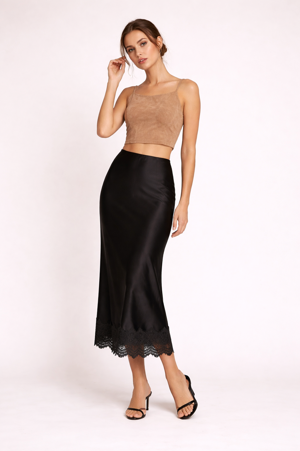 Black elegant women's maxi skirt, featuring a beautiful lace hem for sophisticated evening fashion.