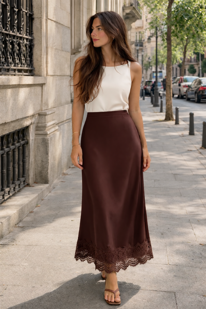 Sophisticated women's maxi skirt with intricate lace hem, designed for elegant formal and evening wear.