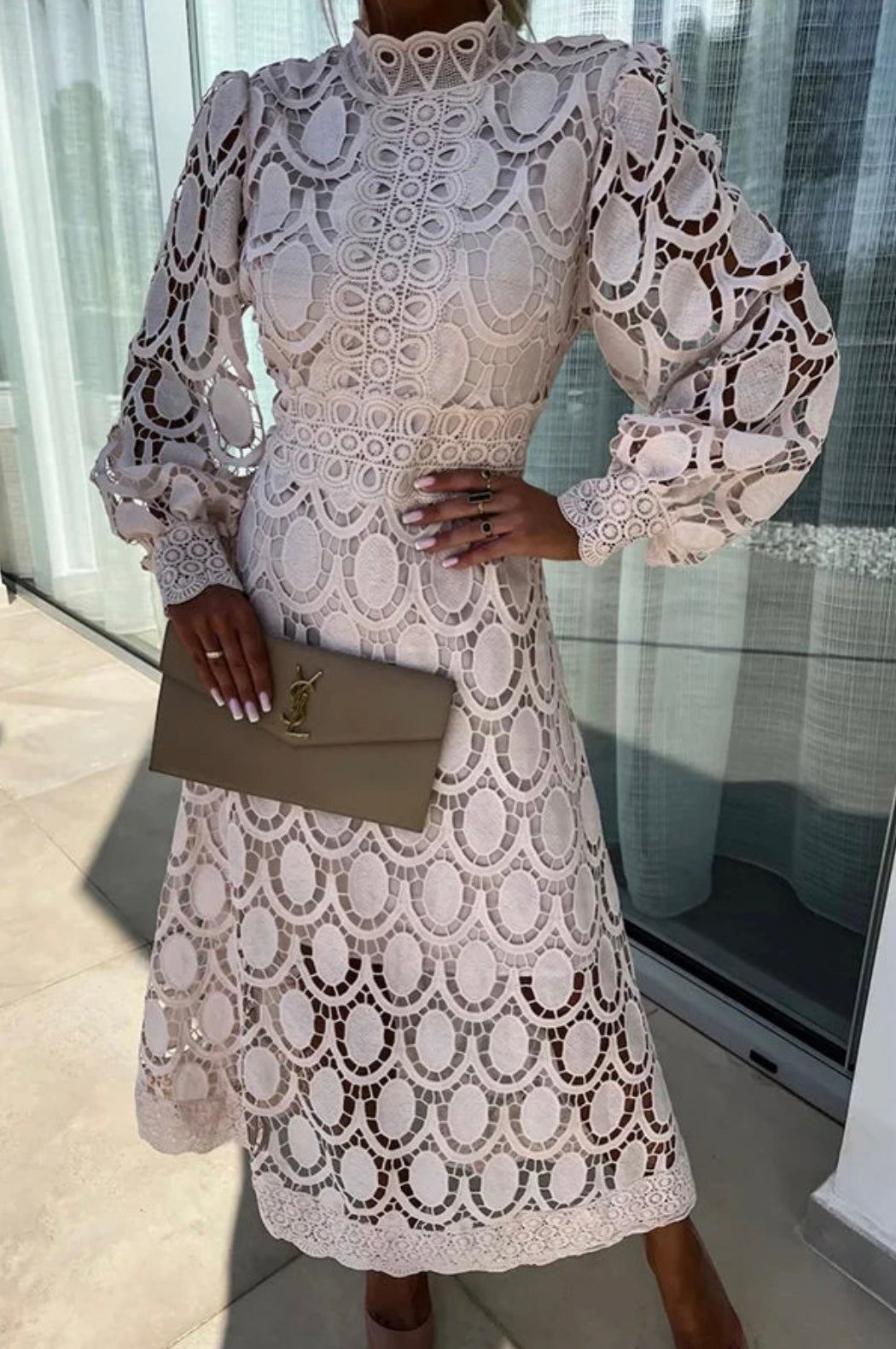 Sophisticated women's A-line midi dress. Features delicate lace, high neck, long sleeves. Ideal for evening wear.