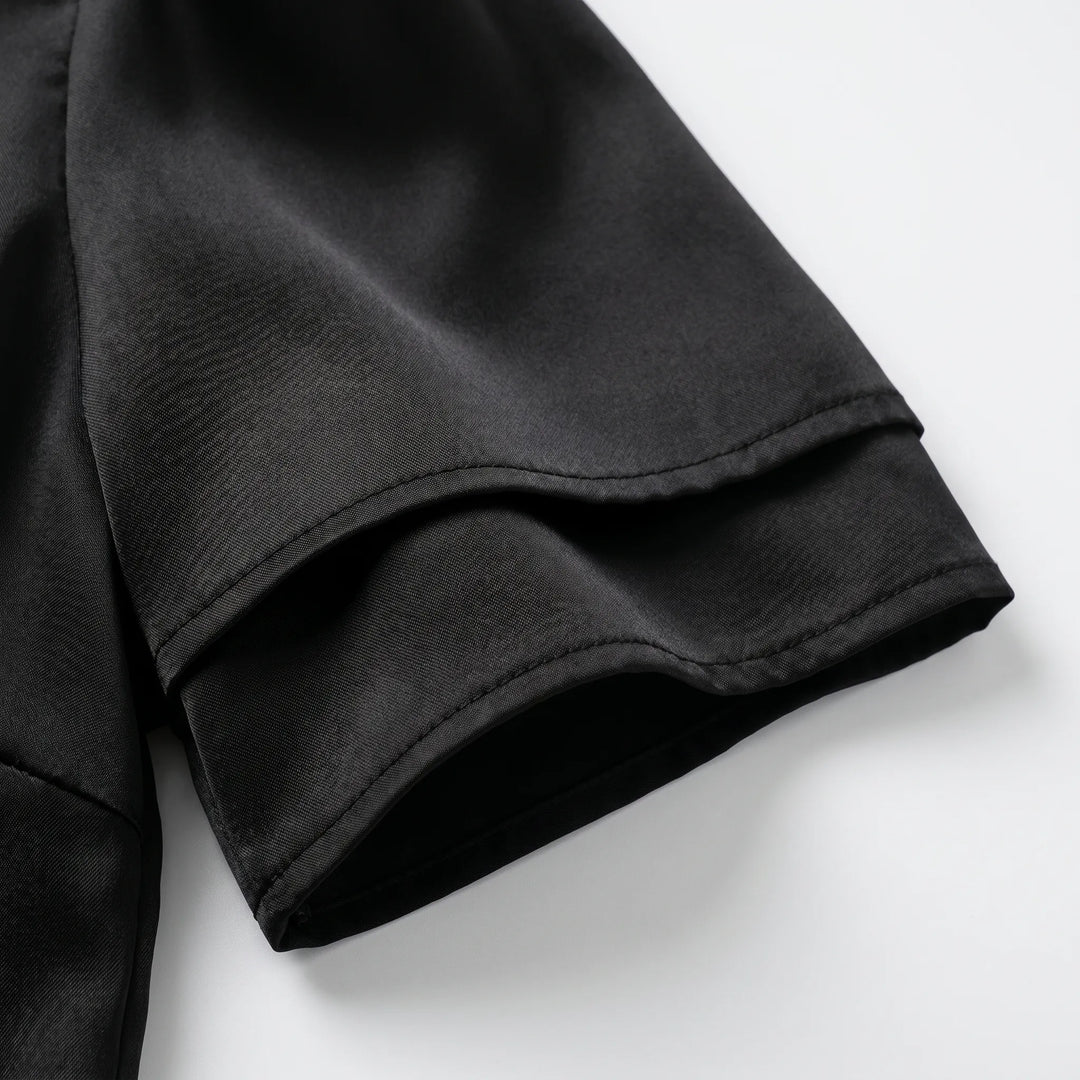 Versatile women's apparel: a sophisticated lace-trim V-neck top with short sleeves for elegant day-to-night wear.