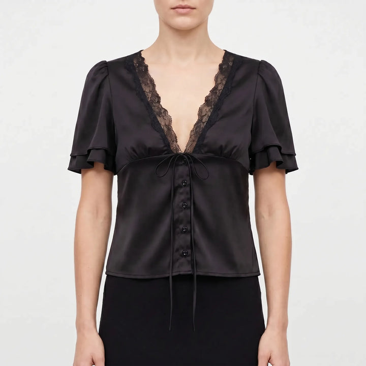 Fashionable women's short-sleeve V-neck blouse with lace trim detail, a versatile elegant top for any occasion.
